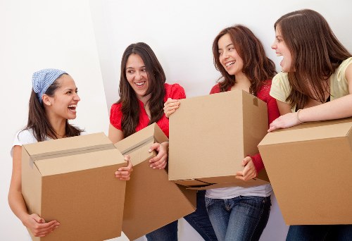 Furniture removals in Holborn with a moving team navigating a central London street