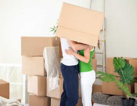 Professional movers carrying furniture in Holborn