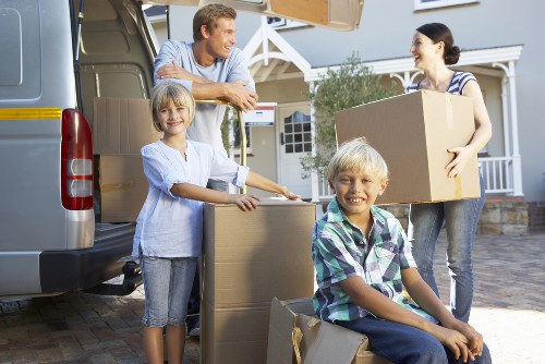Professional movers handling household belongings carefully