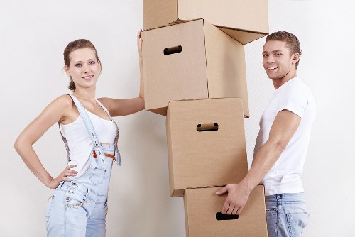 Professional movers carrying items in a Holborn flat
